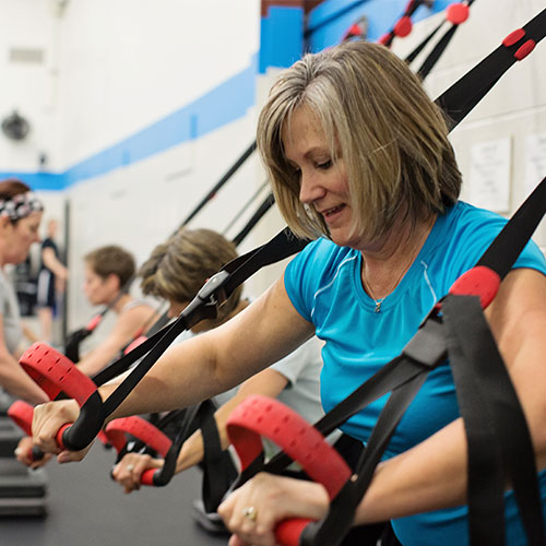 woman working out during weight loss class at afs