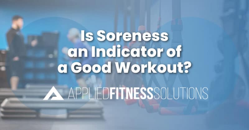 Weightlifter resting between sets, illustrating muscle soreness and recovery after a workout