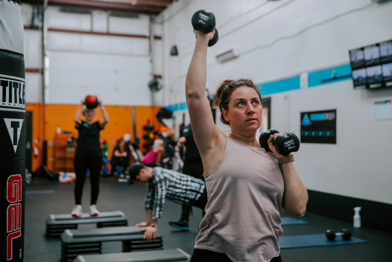 Woman conducting a HIIT class at AFS ann arbor