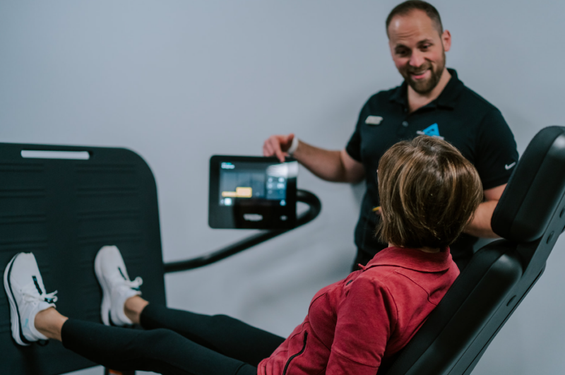 Health coach helping a woman add exercise in her weight loss program
